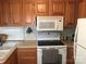 Kitchen boasts wood cabinets and an electric stove at 140 Landlubber Trl # H73, Mount Gilead, NC 27306
