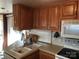 White sink and wood cabinets in the kitchen area at 140 Landlubber Trl # H73, Mount Gilead, NC 27306