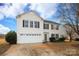 Two-story house with white siding, attached garage, and landscaping at 185 Altondale Dr, Statesville, NC 28625