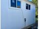 White house exterior with windows and electrical box at 2009 Whippoorwill Ln, Indian Trail, NC 28079