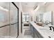 Elegant bathroom with double vanity, glass shower, and marble-look tile at 2323 Rozzelles Ferry Rd # 24, Charlotte, NC 28208