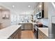 Modern kitchen with gray cabinets, white countertops and stainless steel appliances at 2323 Rozzelles Ferry Rd # 24, Charlotte, NC 28208