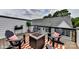 Relaxing rooftop deck with fire pit, chairs, and city views at 2327 Rozzelles Ferry Rd # 26, Charlotte, NC 28208