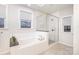 Spa-like bathroom with a soaking tub and a walk-in shower at 2517 Lydia Ave, Charlotte, NC 28205