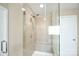 Bathroom with glass shower enclosure, tile surround, and built-in seat at 2654 Treeline Dr, Concord, NC 28027