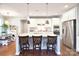 Island kitchen with granite countertops, white cabinets, and stainless steel appliances at 2654 Treeline Dr, Concord, NC 28027