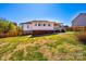 The backyard features a generous grassy area enclosed by a wooden fence at 300 Pine Meadows Cir, Hickory, NC 28601