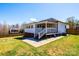 Backyard featuring a fenced-in yard, a covered porch and patio with concrete pavers at 300 Pine Meadows Cir, Hickory, NC 28601
