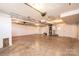 Large unfinished basement space with concrete floor, white painted walls, and visible ducts at 300 Pine Meadows Cir, Hickory, NC 28601