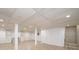 Large basement with tile flooring, white walls and ceiling, with storage options at 300 Pine Meadows Cir, Hickory, NC 28601