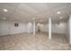 An open basement area with tile floors, white walls, and recessed lighting at 300 Pine Meadows Cir, Hickory, NC 28601
