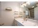 Well-lit bathroom featuring a vanity with decorative shelves, adding a touch of elegance and functionality at 300 Pine Meadows Cir, Hickory, NC 28601