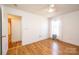 This bedroom features wood floors, a ceiling fan, and a window with natural light at 300 Pine Meadows Cir, Hickory, NC 28601
