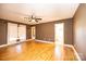 Spacious primary bedroom with hardwood floors and a ceiling fan, offering comfort and style at 300 Pine Meadows Cir, Hickory, NC 28601
