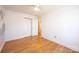 Bright bedroom with hardwood flooring, ceiling fan, spacious closet, and neutral wall paint at 300 Pine Meadows Cir, Hickory, NC 28601