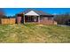 Charming brick home with a well-maintained lawn and cozy front porch at 300 Pine Meadows Cir, Hickory, NC 28601