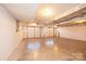 Spacious garage with three bays, concrete floor, and white painted walls at 300 Pine Meadows Cir, Hickory, NC 28601