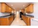 Spacious kitchen features oak cabinets, granite countertops, tile flooring, and black appliances at 300 Pine Meadows Cir, Hickory, NC 28601