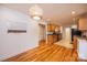 Open concept kitchen and dining with hardwood floors, oak cabinets, and granite countertops at 300 Pine Meadows Cir, Hickory, NC 28601