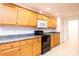 Updated kitchen boasts granite counters, oak cabinets, and black appliances at 300 Pine Meadows Cir, Hickory, NC 28601