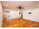 Spacious living room featuring hardwood floors, a ceiling fan, and neutral wall colors at 300 Pine Meadows Cir, Hickory, NC 28601