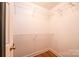 A practical walk-in closet with rod shelving for organizing and storing wardrobe items at 300 Pine Meadows Cir, Hickory, NC 28601