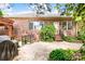 Brick home exterior with beautiful patio, well-manicured lawn, and lush landscaping at 3024 Kern Dr, Salisbury, NC 28147