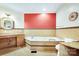 Bathroom with a large tub, tiled walls, granite countertop and custom vanity at 3024 Kern Dr, Salisbury, NC 28147