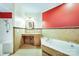 Bathroom with a large tub, tiled walls, granite countertop and custom vanity at 3024 Kern Dr, Salisbury, NC 28147