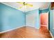 Bright bedroom with hardwood floors, light blue walls, ceiling fan, and ample closet space at 3024 Kern Dr, Salisbury, NC 28147
