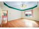 Spacious bedroom featuring hardwood floors, a ceiling fan and a large window at 3024 Kern Dr, Salisbury, NC 28147