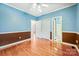 Bright bedroom featuring hardwood floors, neutral walls, and a ceiling fan at 3024 Kern Dr, Salisbury, NC 28147