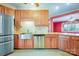 Well-lit kitchen boasting stainless steel appliances, custom cabinets, and granite countertops at 3024 Kern Dr, Salisbury, NC 28147