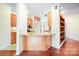 Kitchen area featuring a breakfast bar, granite countertops, and hardwood floors at 3024 Kern Dr, Salisbury, NC 28147