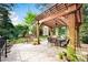 Spacious covered patio with dining area and lush greenery offers a serene retreat at 3024 Kern Dr, Salisbury, NC 28147