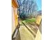 Small backyard with a concrete patio and mature trees at 3959 Briarhill Dr, Charlotte, NC 28215