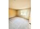 Spacious carpeted bedroom with large window at 3959 Briarhill Dr, Charlotte, NC 28215