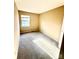 Simple carpeted bedroom with window at 3959 Briarhill Dr, Charlotte, NC 28215