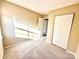Bright bedroom with carpet, window, and closet at 3959 Briarhill Dr, Charlotte, NC 28215