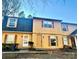 Two-story yellow home with gray roof, two units shown at 3959 Briarhill Dr, Charlotte, NC 28215