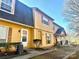 Two-story yellow home with gray roof, two units shown at 3959 Briarhill Dr, Charlotte, NC 28215