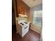 Bright kitchen with white stove and wood cabinets at 3959 Briarhill Dr, Charlotte, NC 28215