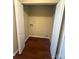 Laundry closet with wood laminate flooring and hookups at 3959 Briarhill Dr, Charlotte, NC 28215