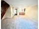 Living room with carpeted floors and wooden staircase at 3959 Briarhill Dr, Charlotte, NC 28215