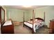 Spacious bedroom with a four-poster bed and ample closet space at 412 Princeton Dr, Salisbury, NC 28144