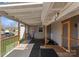 Exterior shot of a backyard deck with a covered area, workout equipment, and play area at 443 Picadilly Ln, Troutman, NC 28166