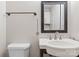 Cozy bathroom with decorative mirror, single vanity and a toilet at 443 Picadilly Ln, Troutman, NC 28166
