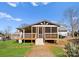 Exterior of house featuring a screen porch and deck with steps leading down to a small green lawn at 443 Picadilly Ln, Troutman, NC 28166