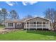 Charming single-story home with a welcoming front porch, lush lawn, and freshly manicured landscaping at 443 Picadilly Ln, Troutman, NC 28166
