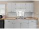 Kitchen with stainless steel appliances, granite countertops and white cabinets that will match most decor at 443 Picadilly Ln, Troutman, NC 28166